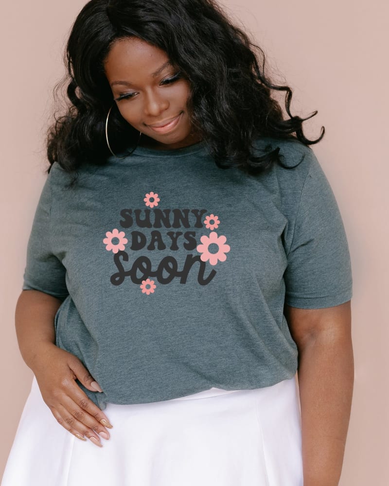 Front of a model wearing a size 2XL Sunny Days Soon Flowers in Forest by Simply Sage Market. | dia_product_style_image_id:281619